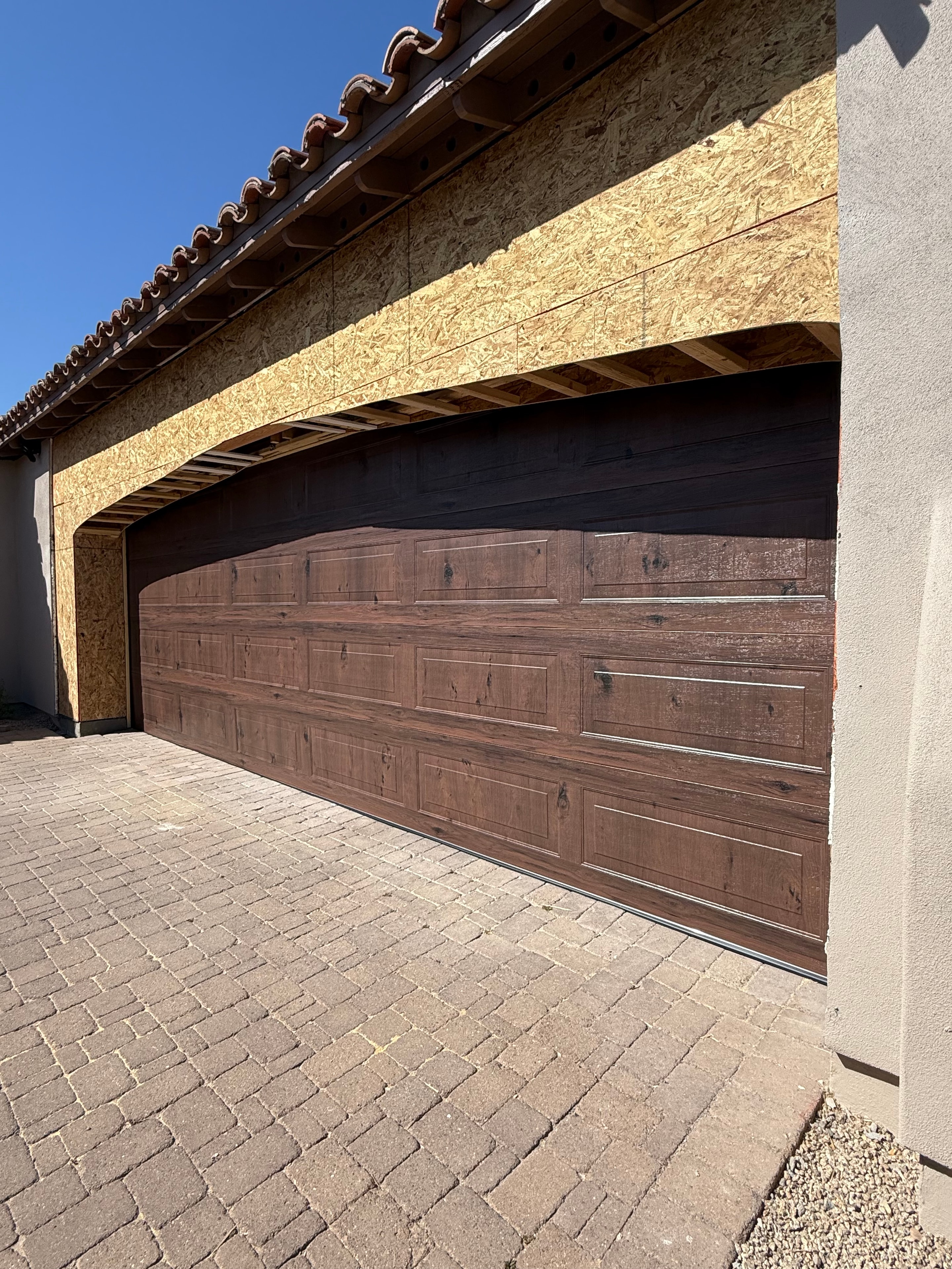 Custom wood-look garage door installation in Scottsdale, AZ