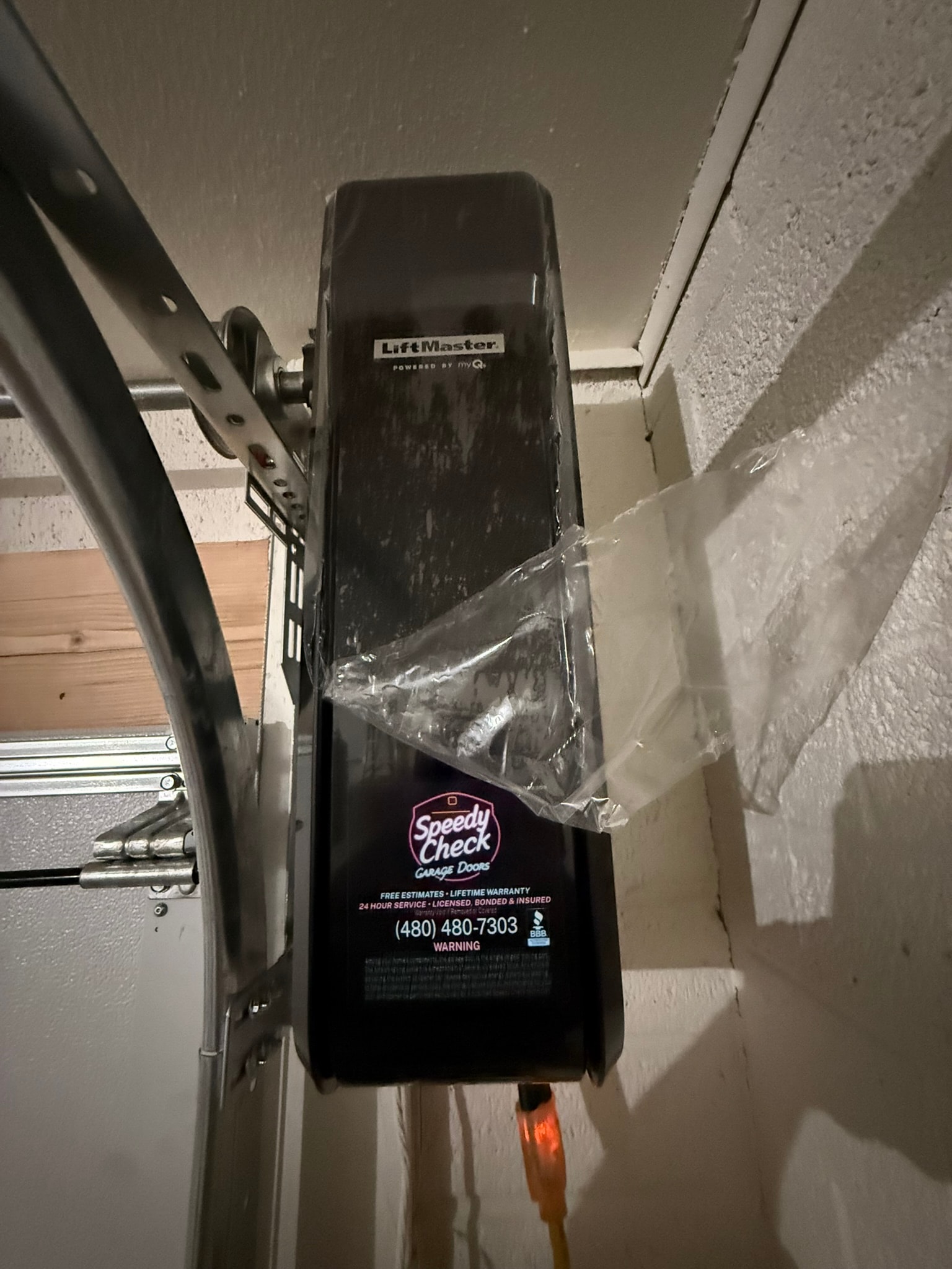 LiftMaster garage door opener installation with Speedy Check branding sticker – Phoenix, AZ